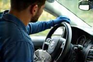 Technician cleaning car interior